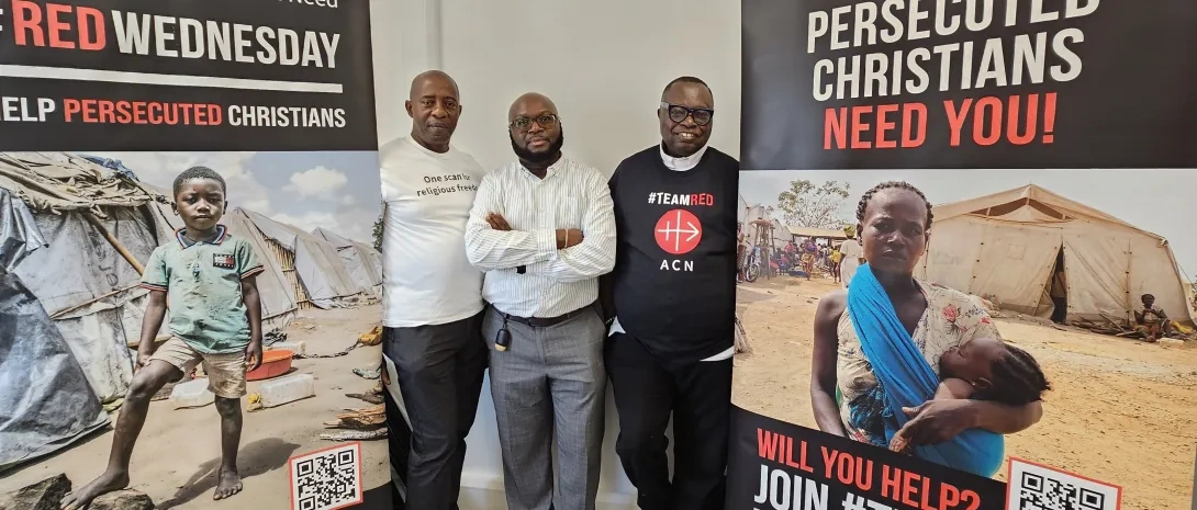Three men standing between two banners about Christian persecution