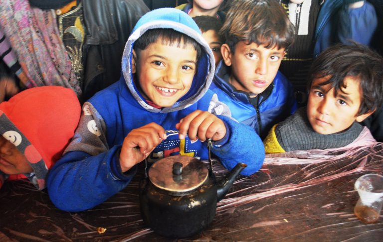 Children awaiting hot lunch at the Jibrin District Displacement Centre for people from East Aleppo, Syria_edited