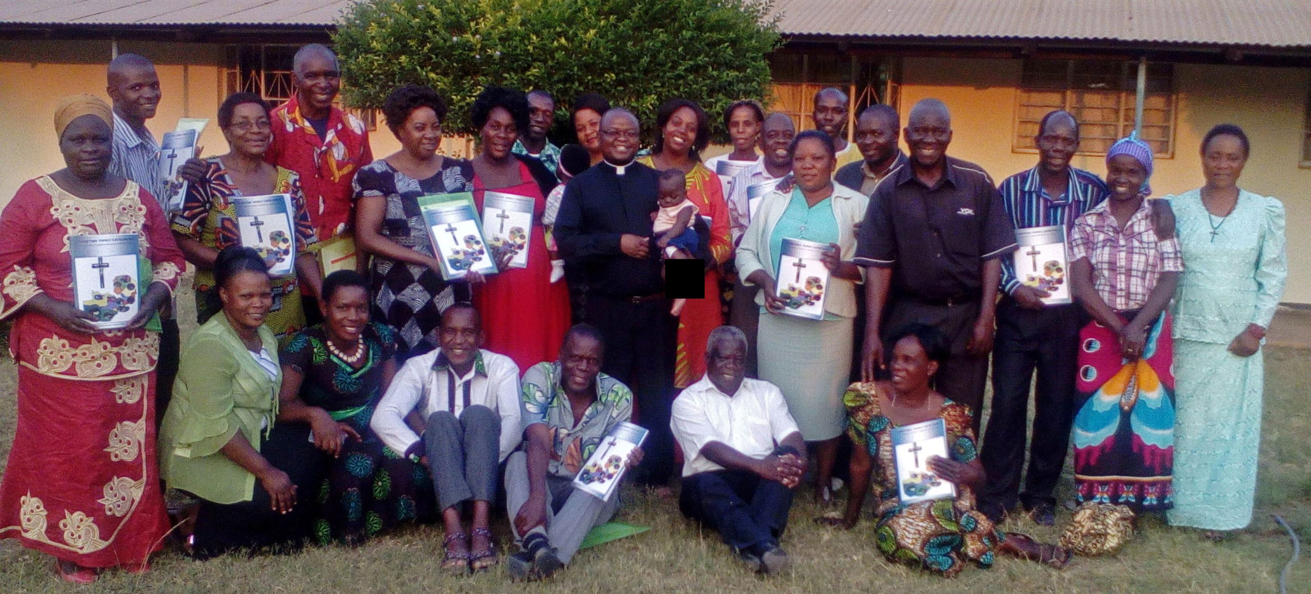 Formation of marriage and family catechists in Zambia, priest with trained couples in Kabwe Diocese
