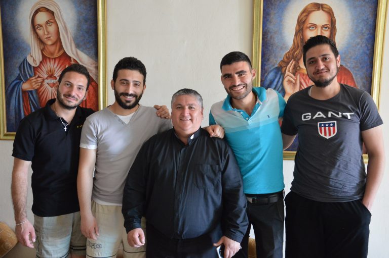 Father David Fernández with students in Aleppo, from left Weaam Panous, Bahe Betros, Antranik Kaspar and Robert Salibi (© Aid to the Church in Need)