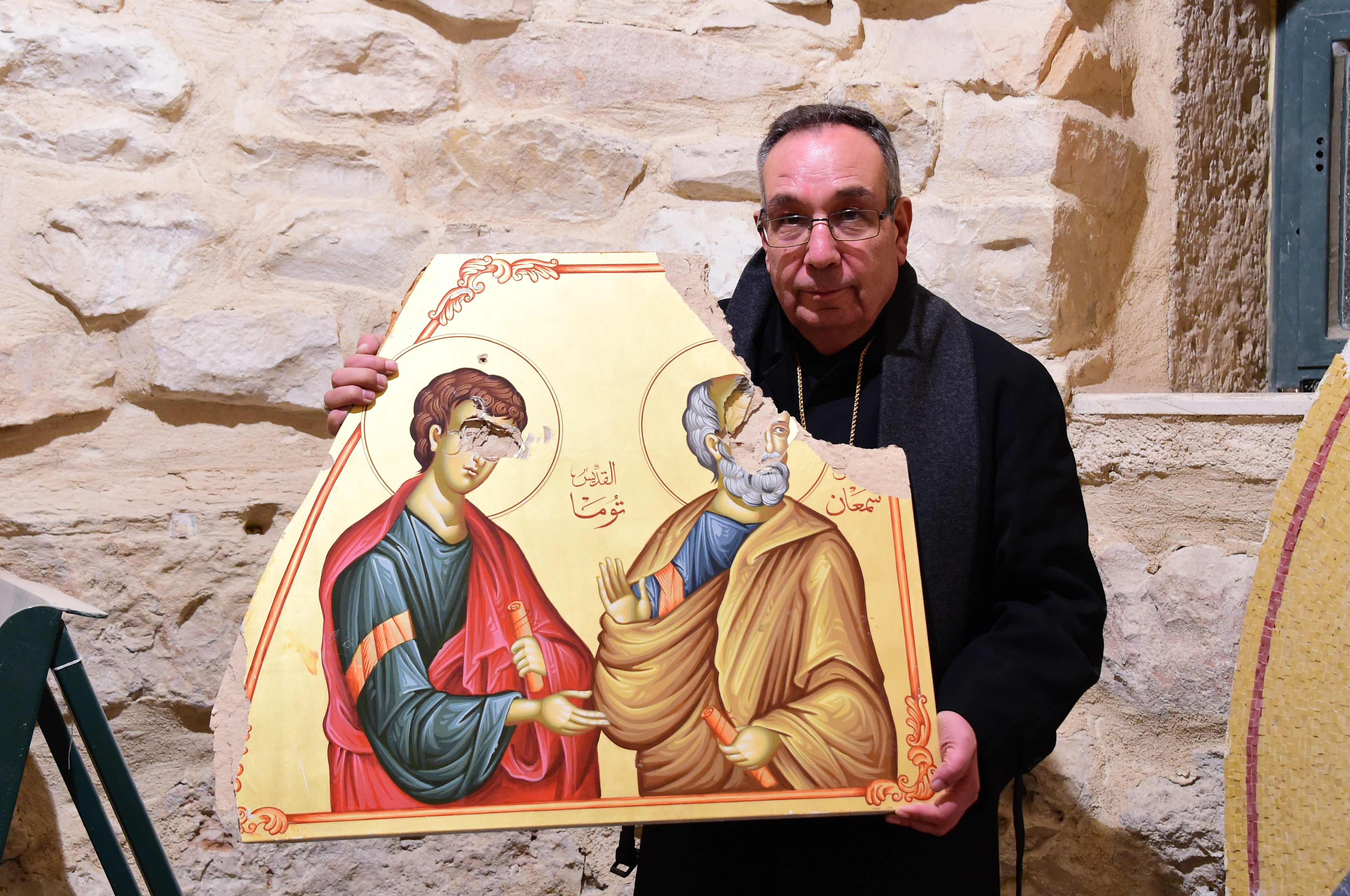 Melkite Archbishop Jean Abdou Arbach of Homs, Hama and Yabroud with an icon destroyed by Islamist militants among the rebels forces (© Aid to the Church in Need)
