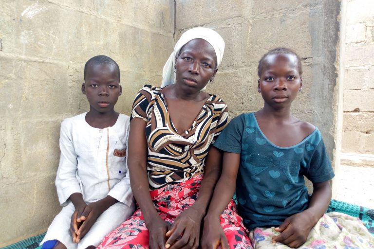 Catherine Ibrahim and her children Daniel and Salome in a displacement camp run by the Catholic Diocese of Maiduguri.