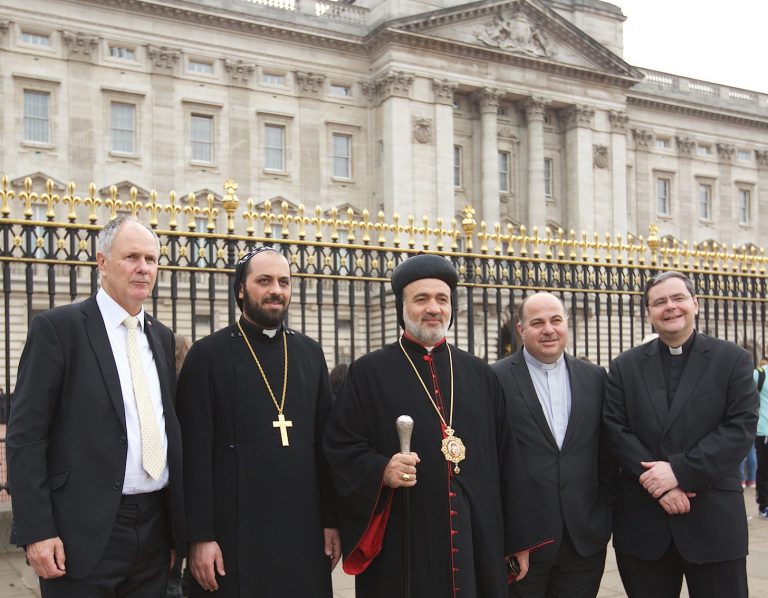 Buckingham Palace – Neville Kyrke-Smith, National Director, Aid to the Church in Need (UK), Syriac Orthodox priest Father Aphram Ozan, Archbishop Athanasius Toma Dawood, leader of the Syriac Orthodox Church in the UK, Father Nadheer Dako, London-based Chaplain of the Chaldean Catholic Community, and Father Dominic Robinson SJ, Chaplain to Aid to the Church in Need (UK) and Superior of Farm Street Jesuit Community, London (© Weenson Oo/picture-u.net)