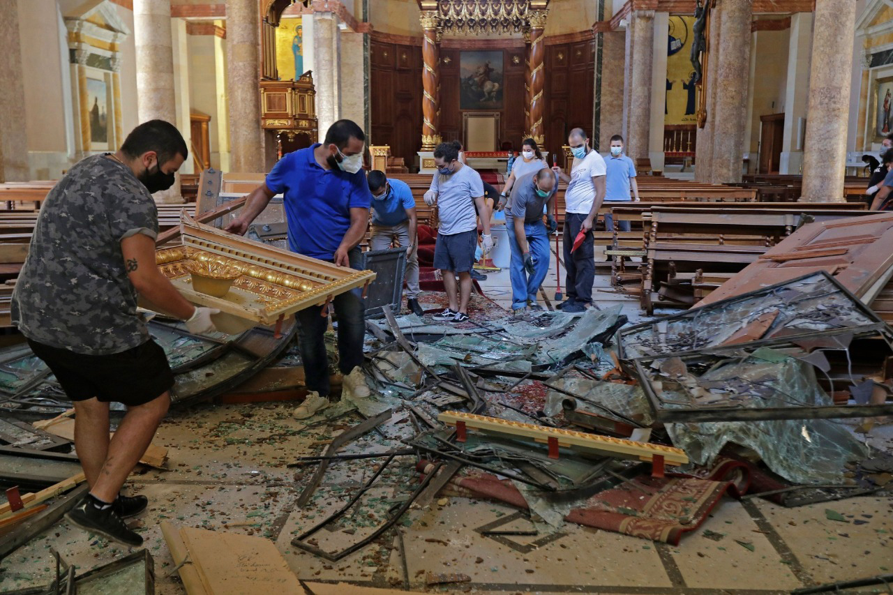 With pictures of young Christian volunteers helping in the wake of the last week’s explosion (© Maronite/Beirut)