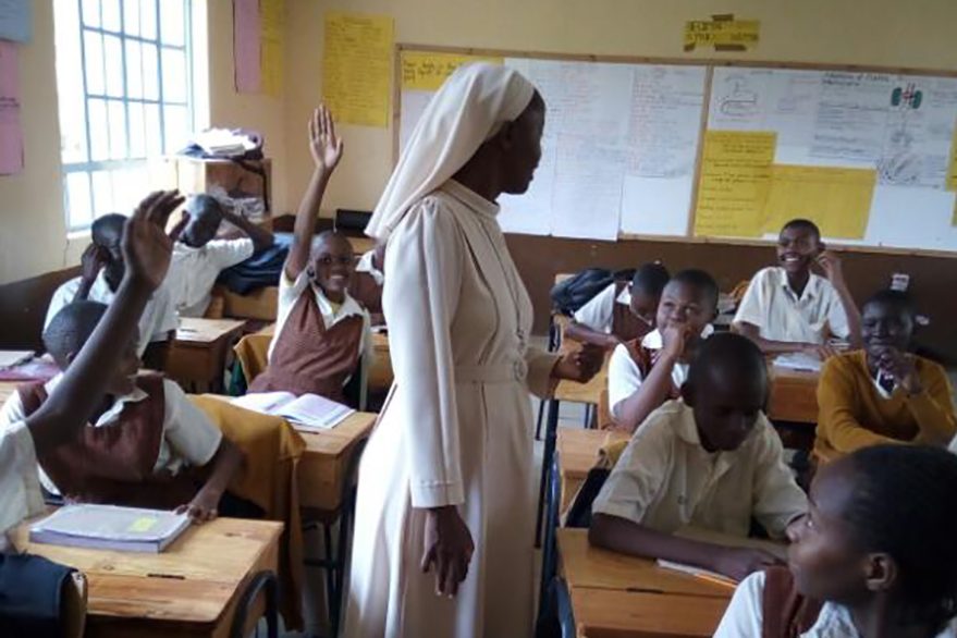 With file image of one of the Daughters of Jesus the Good Shepherd teaching students in Kenya (© Aid to the Church in Need)
