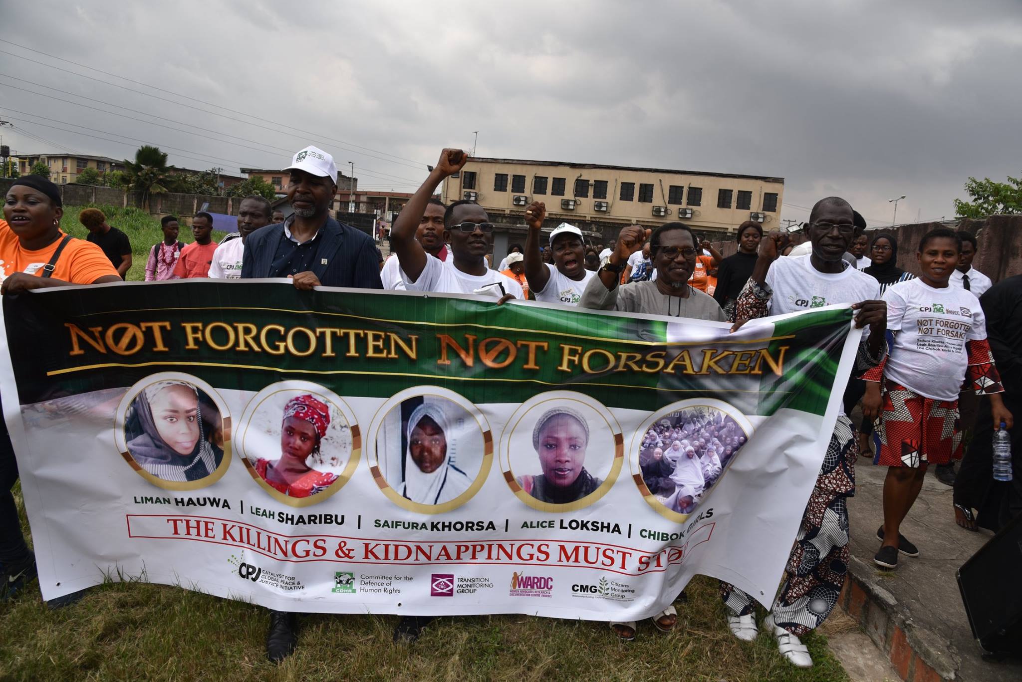 With image of protesting Nigerians (Credit: Catalyst for Global Peace and Justice)