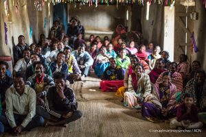 Mission ACN Asia - India 2017 A group of Catholics smile during the words of the priest in the Mission chapel in Jharkhand State.