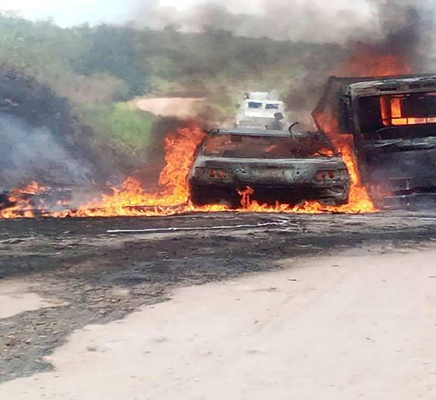 With image of burnt-out car in Butembo-Beni Diocese (© Aid to the Church in Need)