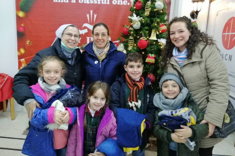 With images of ACN project partner Sister Annie Demerjian and children in Syria supported by the charity this Christmas (© Aid to the Church in Need)