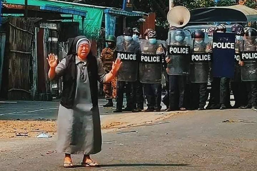 With image of Sister Ann Nu Tawng in front of police during violent protests (Copyright unknown)