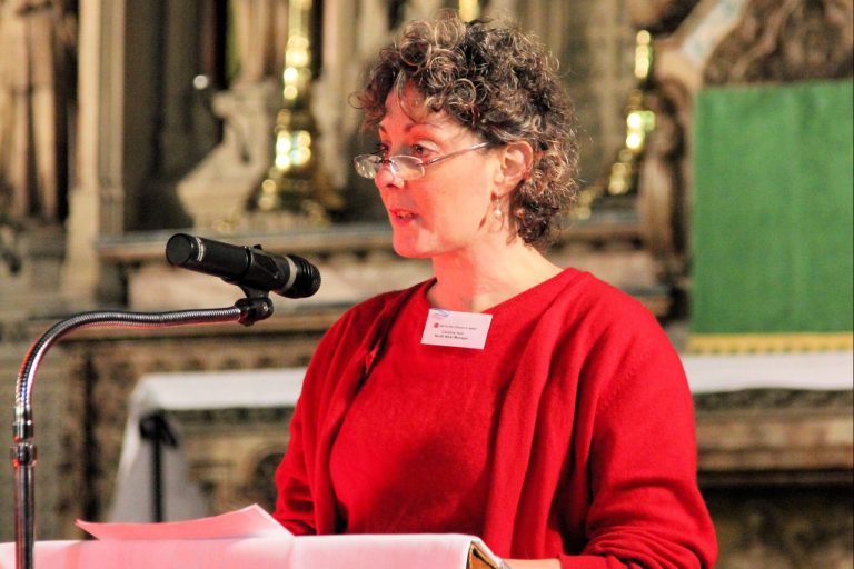 With picture of Dr Caroline Hull speaking at Holy Name Church, Manchester (© Simon Caldwell)