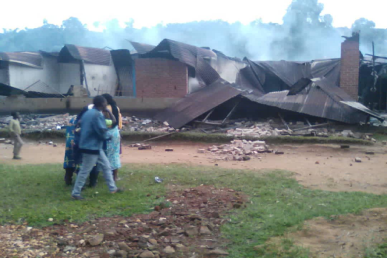 With image of the late Sister Marie-Sylvie Kavuke Vakatsuraki and the burnt-out hospital where she died. © ACN
