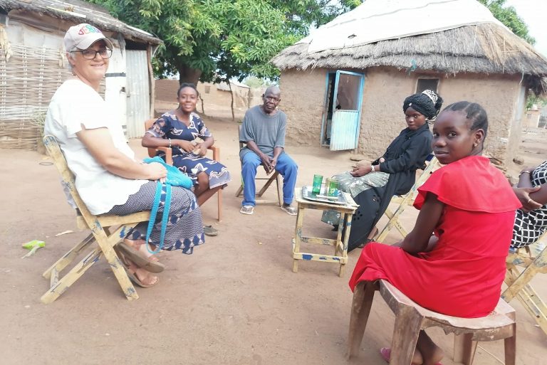 Sister Beta Almendra (left) in Wau ministering to locals.