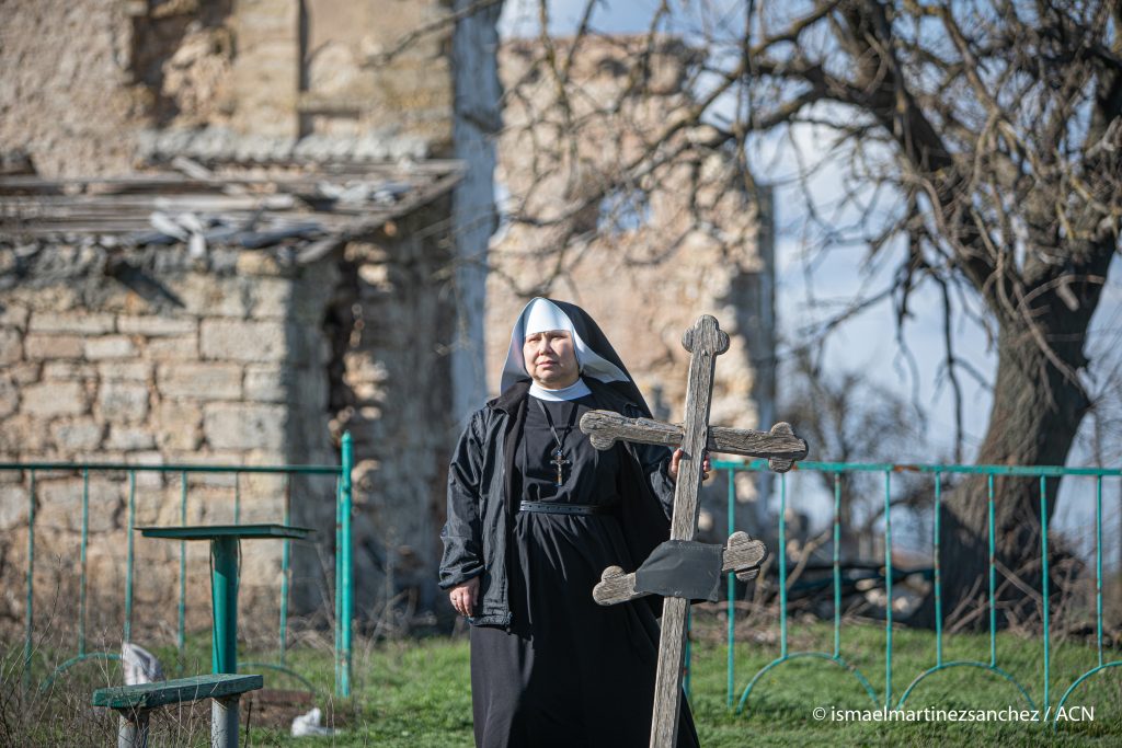 Sister Daniela, from the congregation of the Missionary Benedictine Sisters, in front of the ruined temple of the Catholic church of the Immaculate Conception of Mary. The church was destroyed during the war in Ukraine in 2022 by several Russian bombs in the village of Kyselivka, in the Mikolaiv region, near the Crimean peninsula. On the right of the image, the facade wall remains standing.