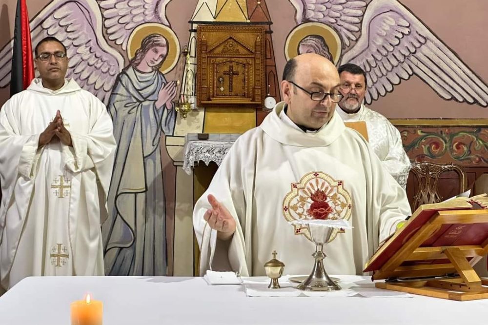 Father Gabriel Romanelli celebrating Mass in Holy Family Church.