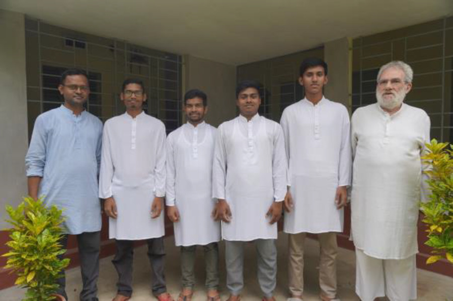 A Jesuit priest with novices in Bangladesh.