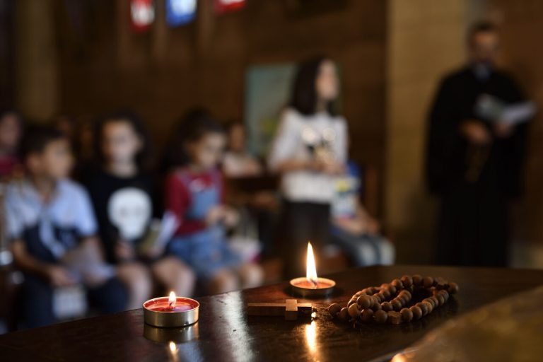 People praying at St. Michael's Greek Melkite Church in Aleppo.