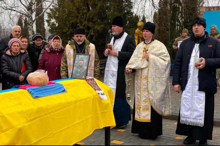 Father Witalij Novak during a funeral.