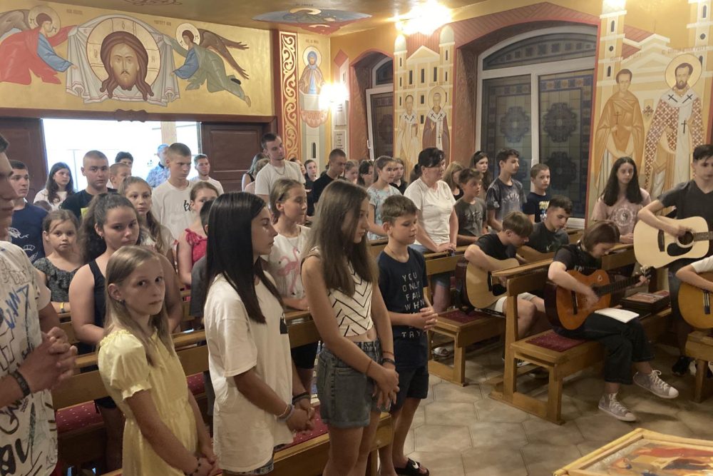 Summer camp youngsters take part in a church service in Mukachevo diocese, Ukraine.